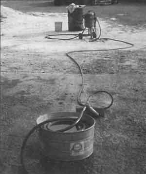 Hose coiled in a washtub of water makes a fine moisture condenser.