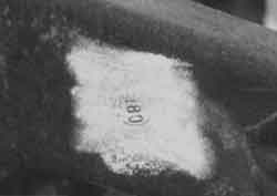 The number 180 within a circle located near the front shock mount was the only mark on the frame of a 1954 GMC (See arrow on picture above). these are not enough digits to be a serial number.
